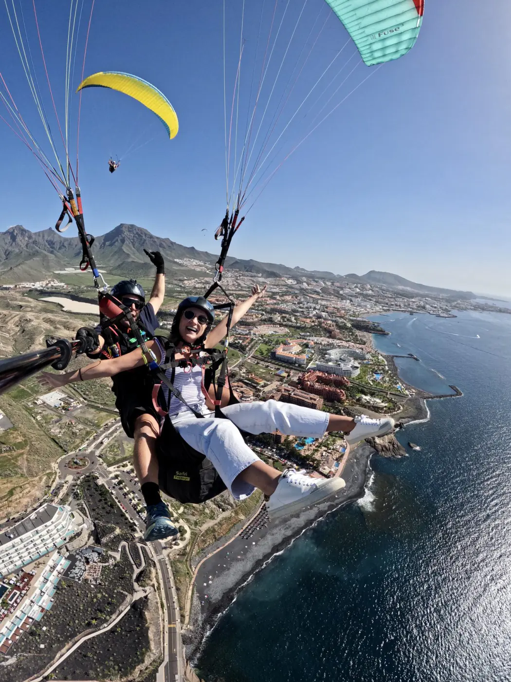 A tandem paragliding flight over the Tenerife coast